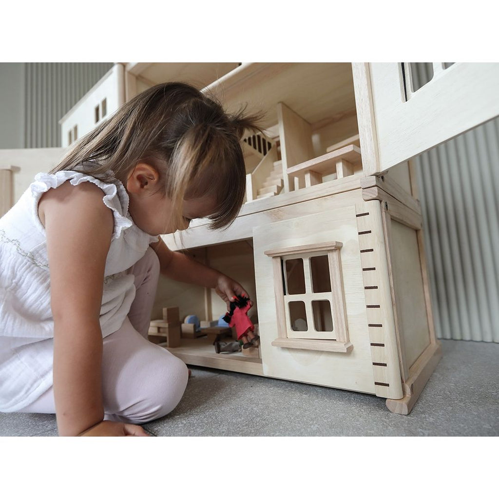Kid playing PlanToys Victorian Dollhouse Basement Floor
